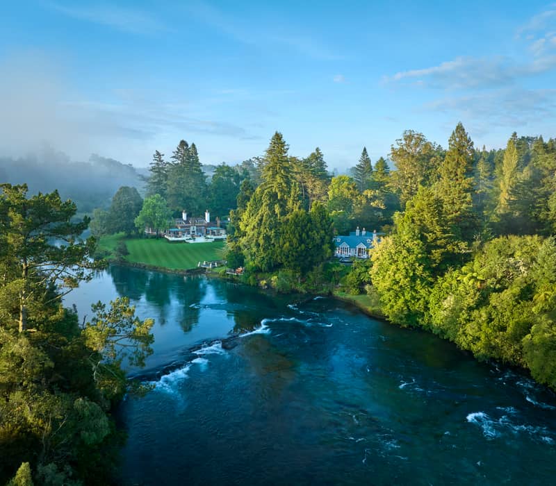 Scenic view of the luxury Huka Lodge property on the edge of the Waikato River in Taupo