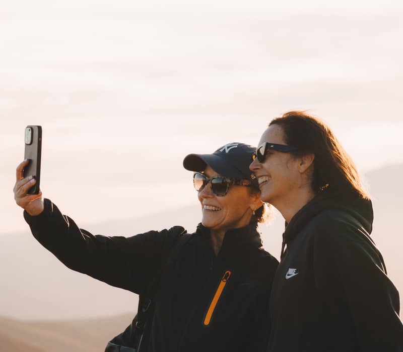 Women taking selfie.
