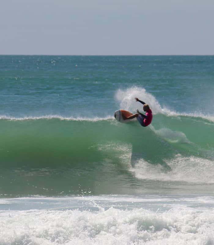 Surfing on Mount Maunganui main beach.